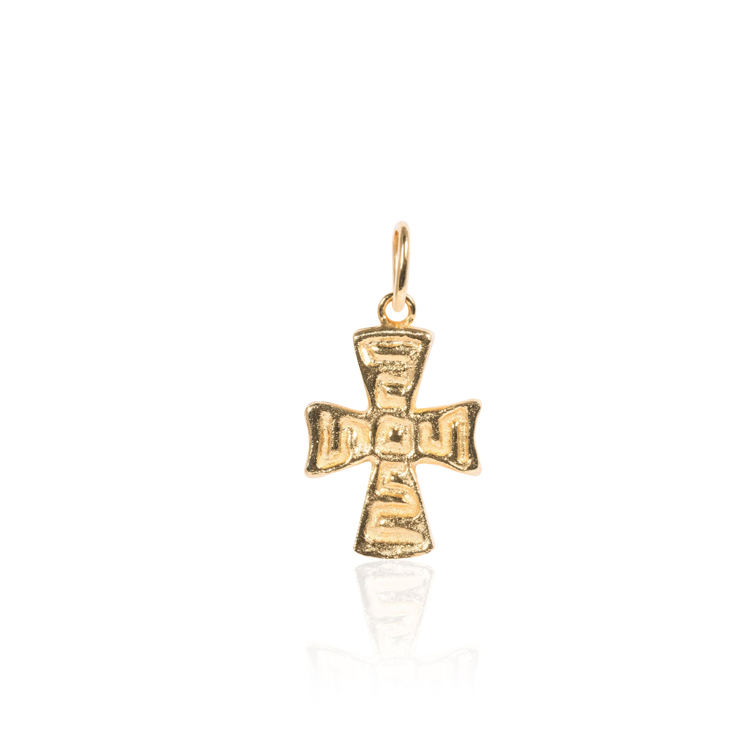 Gold cross pendant on a white background